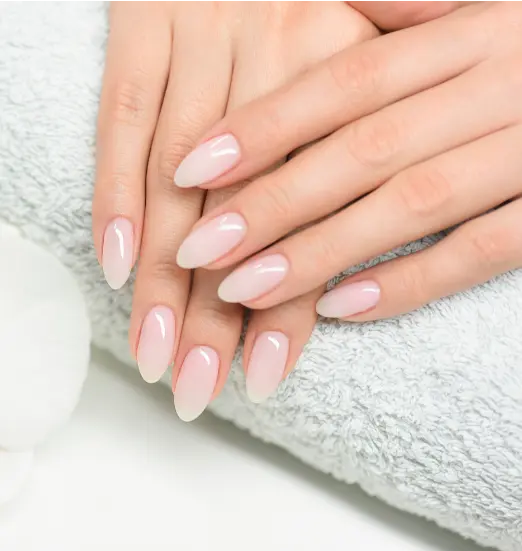 Hands with a long nude pink manicure
